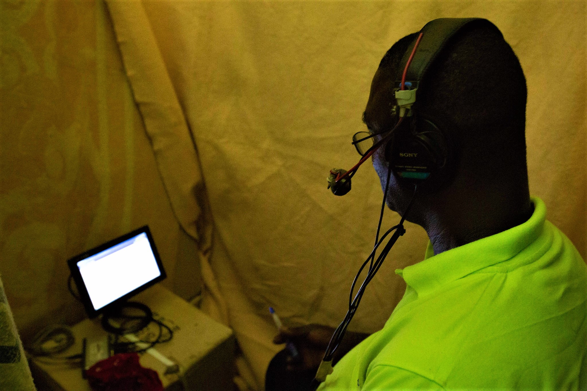 man with headset doing a recording